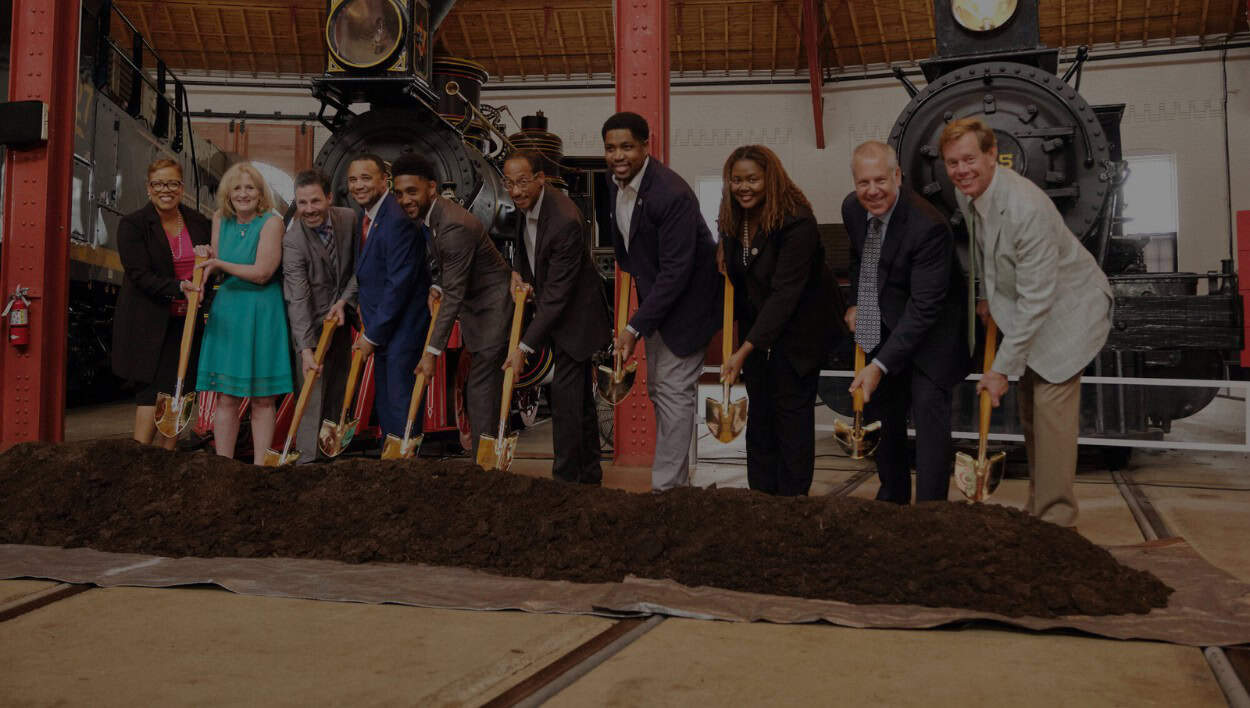 Photo of groundbreaking ceremony at B&O Railroad Museum to showcase Carter's fundraising services.