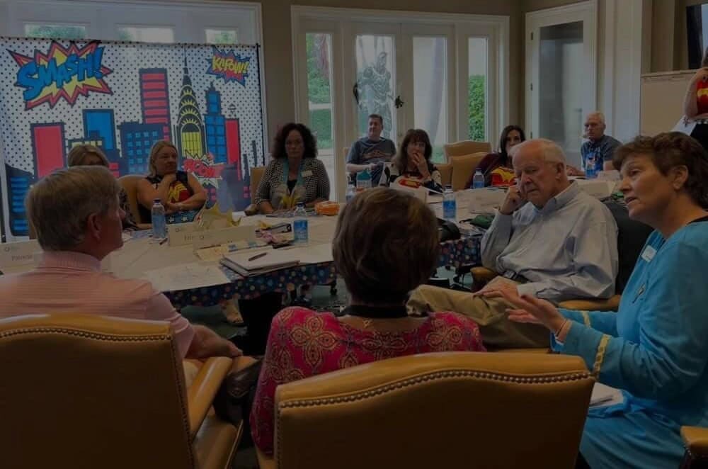 Photo of board meeting at Senior Friendship Centers to showcase Carter's organizational planning services.