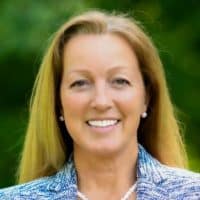 A professional portrait of Carter smiling outdoors, highlighting confidence and approachability for personal branding and professional profiles.