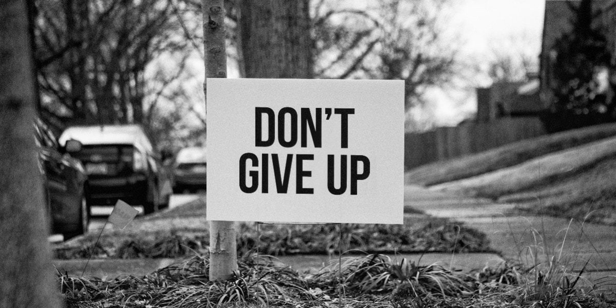 don't give up sign